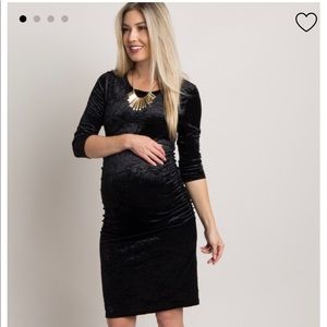 Black crushed velvet, fitted maternity dress.